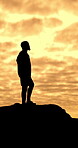 Man, silhouette and sunset for hiking on mountain for fitness, travel adventure and fresh air. Thinking, male person and space for trekking journey, summit challenge and sightseeing to explore nature