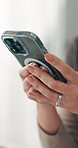 Hands, home and woman with smartphone, typing and website info with message to contact. Closeup, apartment and person with cellphone, internet and digital app for texting, network and connection