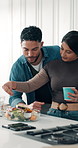 Cooking, salad and couple in kitchen with conversation, affection and bonding in meal preparation. Love, man and woman in house with ingredients, healthy relationship and support in organic recipe.