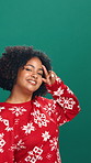 Happy, christmas and face of woman dancing  in studio with festive music for tradition, fun or holiday. Mockup space, energy and portrait of person with groove for xmas playlist by green background.