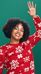 Dancing, christmas and face of woman in studio with festive music for tradition, fun or holiday. Happy, energy and portrait of female person with groove for xmas playlist by green background.