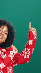 Face, woman and excited for Christmas, pointing and promotion for December discount offer in studio. Green background, festive season and black person with suggestion for Xmas deal, happy and sale