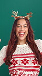 Christmas, celebration and dance with face of woman in studio for excited, energy or fun. Success, winner and laughing with happy dancer person on green background for festive season or holiday event
