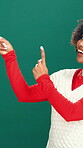 Studio, Christmas and woman with presentation, pointing and happy for festive season discount offer. Green background, holiday and black person with smile for sale, announcement or promotion for xmas