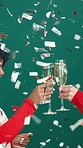 Christmas, confetti and women with champagne toast in studio for holiday, cheers and festive season. Excited, glitter and happy friends with drinks for party, xmas and celebrate on green background