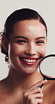 Skincare, face or woman in studio with magnifying glass, detail or acne check in beauty inspection. Smile, cosmetology or girl on white background with lens, investigation or search for blackhead.