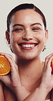 Face, woman and orange for skincare in studio with beauty, hydration and facial healing. Portrait, person and organic fruit with natural glow, healthy skin and collagen treatment on white background