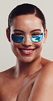 Skincare, face and happy woman with eye mask in studio, self care or dark circles treatment for wellness. Health, natural beauty and person with patches for grooming, dermatology and white background