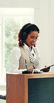 Headphones, tablet and hotel receptionist dancing and listening to music or playlist in morning. Digital technology, audio tech and female concierge streaming album with hospitality career at lodge.