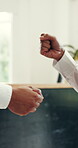 Fist bump, team and hands of people in hotel for hospitality, support and receptionist agreement. Welcome, accommodation partnership and connection with employee in lobby of lodge for concierge