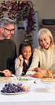 Grandparents, family and children with turkey at thanksgiving dinner, happy and bonding on holiday. Senior people, girl and boy with smile for food, celebration and excited with talk in dining room