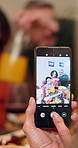 Family, phone and camera with picture for thanksgiving dinner, memory or photography in home. Parents, child and mobile smartphone display with meal for capture moment, dining or bonding in house 