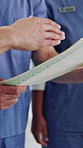 Hands, doctors and document in meeting at hospital with planning, chart and healthcare services. Person, team and folder with medical report, paperwork and explain with feedback for job at clinic