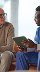 Conversation, healthcare or tablet with nurse and patient in home for advice, consulting or insurance. App, medical or speaking with caregiver and senior man in apartment for appointment or checkup