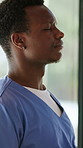 Black man, thinking and nurse with stress in hospital, patient loss or fail with difficult surgery. Healthcare worker, sad and person with bad news, medical burnout and worry for mistake by window