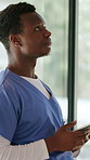 Man, stress and tired nurse with tablet, breathing and thinking by window in clinic. Healthcare worker, fatigue and black person in hospital with bad news, medical burnout and reflection for mistake