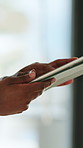 Hands, person and typing with tablet in office for research, editing article and submission feedback. Closeup, journalist and digital scroll for copywriting report, draft update and media publication