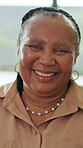 Relax, smile and face of old woman in home for retirement, weekend break and confidence. Happiness, pride and comfortable with portrait of black person in living room of apartment for free time