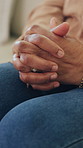 Hands, stress and old woman with anxiety on sofa for dementia, worry and uncertain in retirement. Nervous, elderly person and concern in home for alzheimer, overthinking and praying for memory loss