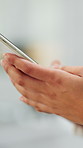 Hands, mobile and business person typing in office for networking, email or text on app. Phone, online chat and consultant in workplace for research, internet update and message notification closeup
