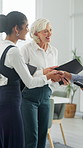 Business, people and handshake with tablet in office for welcome, introduction and project agreement. Smile, women and shaking hands for onboarding, company partnership and thank you for negotiation