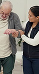Nurse, man or elderly patient with mobility for support, help or healthcare in clinic. Retirement, physiotherapy and caregiver with smile, movement aid and senior person with a disability in hospital