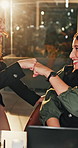 Night, fist bump and business women with laptop for meeting, celebration or brainstorming together. Feedback, research and design team with person online for deadline, goal or support with flare
