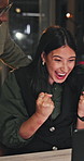Night, fist pump and business people with laptop for achievement, celebration or winning together. Feedback, approval and design team with person online for deadline, goal or support with flare