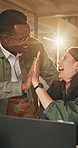 Night, high five and business people with laptop for achievement, celebration or winning together. Feedback, approval and design team with person in office for deadline, goal or support with flare
