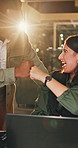 Night, fist bump and business people with laptop for achievement, celebration or winning together. Feedback, approval and design team with person in office for deadline, goal or support with flare