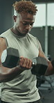 Weightlifting, dumbbell and exercise with man in gym for intense workout, bicep curl or fitness. Health, wellness or bodybuilding challenge with person in sports club for strong, athlete and training