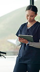Nurse, woman or scroll in hospital with tablet for patient information, medical research or admin. Caregiver, reading or plan with tech in hospice with test results, healthcare records or digital app