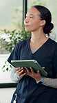 Nurse, woman and thinking with tablet for research, patient information and medical decision. Caregiver, reflection and scroll with tech in hospital for test results, healthcare idea and planning.