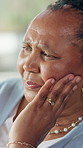 Thinking, sad and senior woman in home with memory, reflection or nostalgia in living room. Alzheimers, depression and elderly female person in retirement with planning for day on sofa in house.