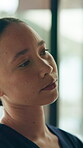Nurse, sad or woman with thinking in healthcare, overwhelmed or tired with homecare. Reflection, memory and female caregiver with depression, fatigue or serious overwork with unhappy medical worker
