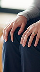 Anxiety, worry and hands of person on sofa for counseling session, therapy and consulting. Psychology, closeup and woman in therapist office with nervous, stress and anxious for mental health support