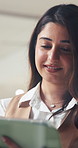 Tablet, reading and business woman in office with feedback, review report or insurance claims. Smile, digital technology and broker in workplace for research, policy planning or check schedule online