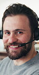 Face, headset and support with man in call center for assistance, contact us or virtual help. Communication, conversation and customer service with happy person in coworking office for consulting