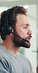 Communication, headset and support with man in call center for assistance, contact us or virtual help. Conversation, customer service and feedback with person in coworking office for consulting