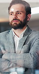 Thinking, business and man with arms crossed, window and solution with career ambition. Consultant, pride and employee in office, view and positive mindset with problem solving, decision and ideas