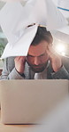 Frustrated, businessman and stress with documents on laptop for overworked or pressure in office. Man, employee or headache with migraine or anxiety for workload, deadline or strain in workplace