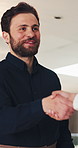 Smile, business man and handshake in office for welcome, introduction and partnership agreement. Talk, happy worker and shaking hands for greeting, deal negotiation or b2b collaboration in workplace