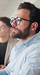Business, man and staff listening in meeting for training, career development and proposal feedback. Person, employees and attention for corporate convention, learning session and coaching tradeshow