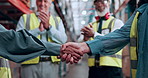 Logistics, people or handshake with applause in warehouse for partnership deal, B2B or agreement. Celebration, courier and shipping team with shaking hands for supplier contract and industry welcome
