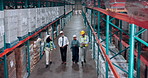 Above, supply chain and people in factory, walking and logistics with inspection. Inventory, distribution and employees in warehouse, discussion or maintenance with quality control, import and export