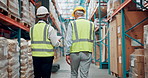 Walking, warehouse and back of men in meeting for inspection, quality control and inventory check. Shipping, production team and supervisor talking for logistics, supply chain and distribution