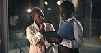 Night, manager and woman with tablet in office, feedback meeting and tips to edit investment proposal. Overtime, director and people with tech in workplace, ideas and advice for finance presentation.