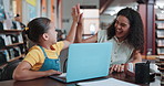 Library, woman and high five with child, laptop and happiness for score on assignment or achievement. Academic, success and tutor with smile for student development, online and celebration for win