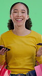 Woman, face and credit card in studio for shopping bag, smartphone or fintech on green background. Girl, phone and happy in portrait with mobile app, ecommerce and discount sale for fashion in Mexico