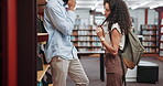 Romance, flirting and people in library with talking, conversation and crush in university attraction. Love, smile and students in college with affection, gen z and social chat on study break.